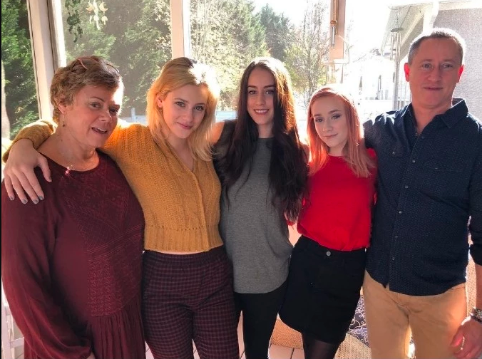 Chloe with her parents and two sister enjoying her lavish lifestyle.